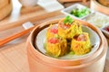 Crab Dumplings in chinese style in bamboo tray in asian restaurant