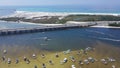 Crab Island with dense of tourist boats, yachts near Destin Bridge or William T. Marler Bridge, overlooking white sandy Eglin Royalty Free Stock Photo