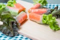 Crab roll salad on a wooden cutting board Royalty Free Stock Photo