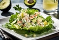 A crab salad with lettuce, avocado, cucumber, and lemon dressing