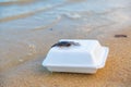 Crab sitting on a disposable plastic food container