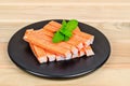 Crab Stick in black dish. Royalty Free Stock Photo