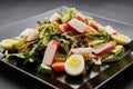 Crab stick salad with fresh vegetable and eggs Royalty Free Stock Photo