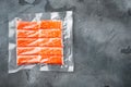 Crab stick surimi vacuum pack, on gray background, top view flat lay , with copyspace and space for text