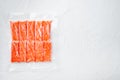 Crab stick surimi vacuum pack, on white background, top view flat lay , with copyspace and space for text