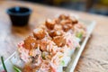 Crab stick sushi roll plate with tempura shrimp and mango sauce Royalty Free Stock Photo