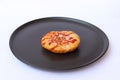 Crab sticks bread mayonnaise with ketchup and dried oregano topping in the black round plate