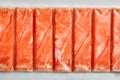 Crab sticks or imitation crab meat surimi in a package top view Royalty Free Stock Photo