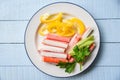 Crab sticks with sweet bell peppers and fresh Celery vegetable on plate food Royalty Free Stock Photo