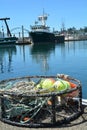 Crab trap and fishing boat Timmy Boy in Newport, Oregon Royalty Free Stock Photo