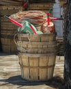 Crabpot floats stacked in wooden bushel baskets on pier