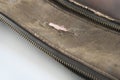 Crack of brown leatherette bag Damage due to lifetime