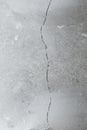 Crack in cement floor from shrinkage of house Royalty Free Stock Photo