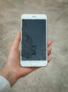 Crack Display Smartphone Screen Holding on Hand Royalty Free Stock Photo