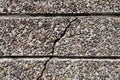 Crack in gray stone wall close up Royalty Free Stock Photo