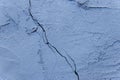 Crack on old dirty blue paint concrete wall of cement surface broken background damage cracked texture Royalty Free Stock Photo