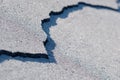 A crack in the pavement on the road. The concept of bad roads Royalty Free Stock Photo