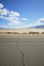 Crack in road with desert background Royalty Free Stock Photo