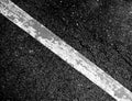 Crack and texture of asphalt road with white dashed line. Royalty Free Stock Photo