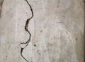 Crack texture on old gray stucco. Cracked wall background Royalty Free Stock Photo