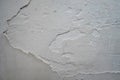 Crack. Texture of old painted white plaster. Cracked wall. white wall with cracks Royalty Free Stock Photo