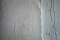 Crack. Texture of old painted white plaster. Cracked wall. white wall with cracks Royalty Free Stock Photo