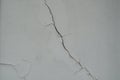 Crack in the Wall Simple White Cement Wall Texture for background and design art work Royalty Free Stock Photo