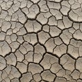 Cracked, arid soil displaying polygonal patterns of dried mud. The greyish-brown Royalty Free Stock Photo