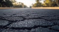 Cracked Asphalt Road A Close-Up View of Time and Texture in Motion's Path Royalty Free Stock Photo