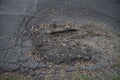 Cracked asphalt road with footprint of wheel