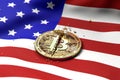 Cracked Bitcoin coin on American flag. Bad Bitcoin condition in USA concept. 3D Rendering