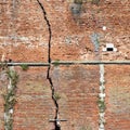 Cracked brick wall - Deep crack in a brick wall