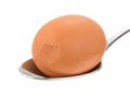 Cracked brown egg on a spoon Royalty Free Stock Photo