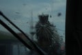 car windshield with a crack, the rain, the road