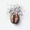 A cracked coffee bean surrounded by ice and grounds creates a refreshing, energizing scene. Royalty Free Stock Photo