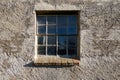 window in cracked and weathered wall outside Royalty Free Stock Photo