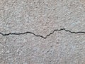 Cracked concrete surface covered with gray cement mortar. Destruction after the earthquake. Royalty Free Stock Photo