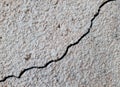 Cracked concrete surface covered with gray cement mortar. Destruction after the earthquake. Royalty Free Stock Photo