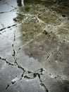 Cracked concrete surface with deep erosion texture Royalty Free Stock Photo