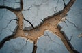 Cracked concrete surface dry, sandy ground with small pebbles. Abstract texture pattern suggests drought, arid conditions. Broken Royalty Free Stock Photo