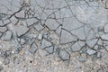 Cracked concrete texture background. Damaged concrete surface. Wet concrete surface after rain.