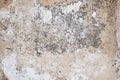 Cracked concrete wall covered with gray cement surface. Grey old wall with shabby damaged plaster or cement and brick background Royalty Free Stock Photo