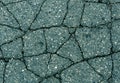 Cracked cyan asphalt surface. Royalty Free Stock Photo