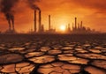 Cracked dried earth with industry pollution at sunset background. Royalty Free Stock Photo