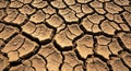 Cracked, dry earth forms irregular patterns across the surface. The ground appears parched, with Royalty Free Stock Photo