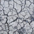 Cracked and dry  gray soil. Royalty Free Stock Photo