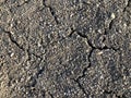 Cracked dry ground mud, dried under sun road. Royalty Free Stock Photo