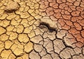 Cracked, dry soil displaying a patchwork of clay segments in Royalty Free Stock Photo