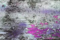 Cracked dye on wooden wall. Purple and pink colors on old board