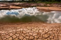 Cracked earth near drying water on twilight at at Sam Pan Bok in Mekong river. Ubonratchathani Province ,Thailand Royalty Free Stock Photo